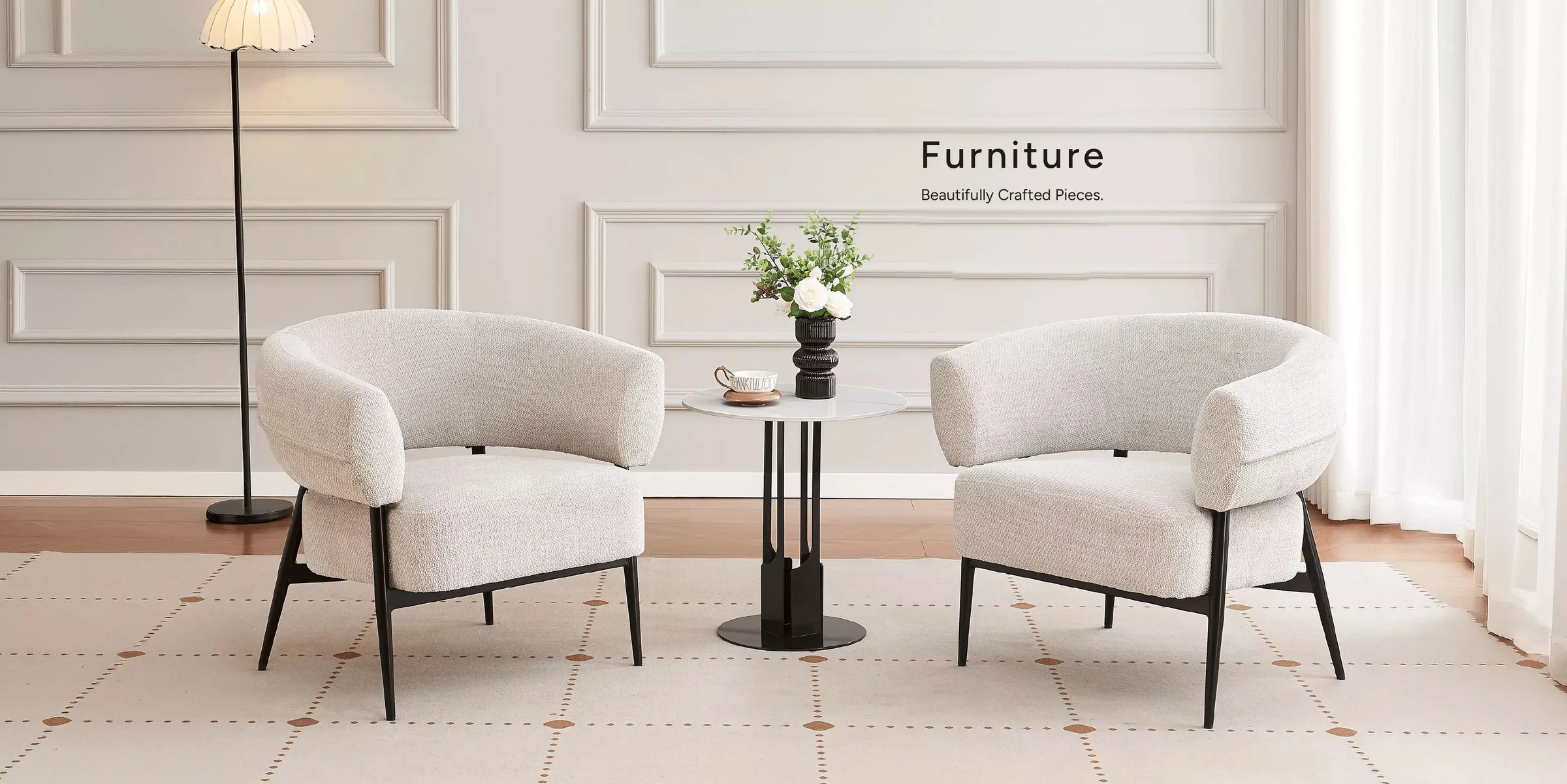 Furniture. Beautifully crafted pieces — a pair of bouclé armchairs and a marble side table in a panelled living room. Shop home.